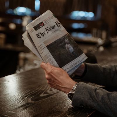 Close-up shot of a man's hands gripping a pull-up bar firmly.